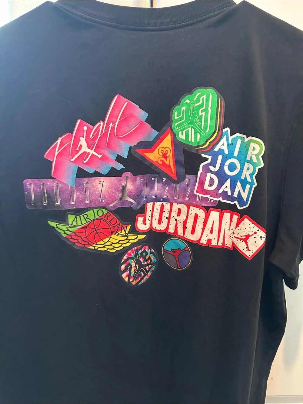 Jordan Black Tee with Multicolor Retro Badge Graphics